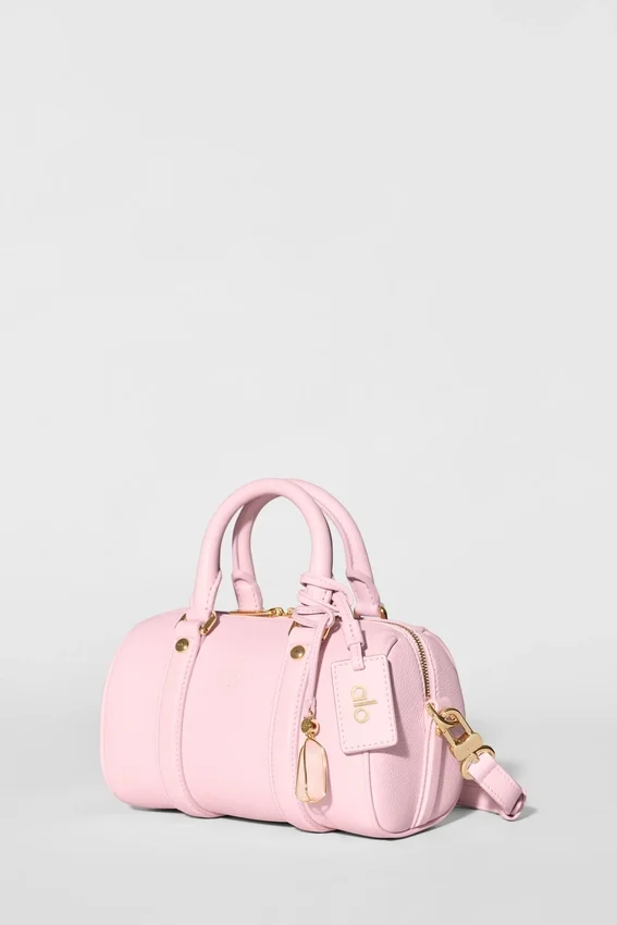 Alo Mini Voyage – solblekt rosa läder