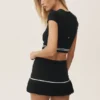 My Serve-tenniskjol i bomull och kashmir med High-Waist-modell – svart/vit